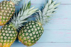 Three fresh green tropical pineapples fruit