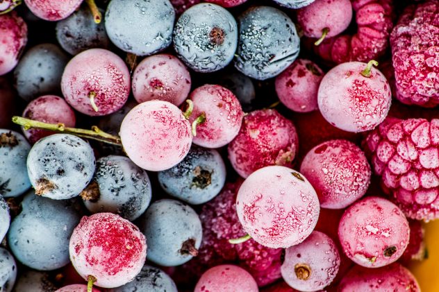 frozen berries, black currant, red currant, raspberry, blueberry. top view. macro