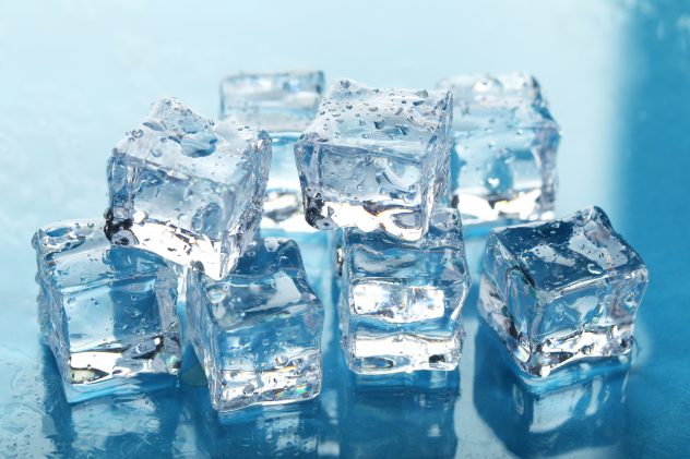 Ice cubes on blue background