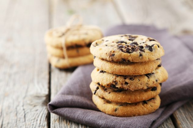 Chocolate chip cookies on grey wooden background