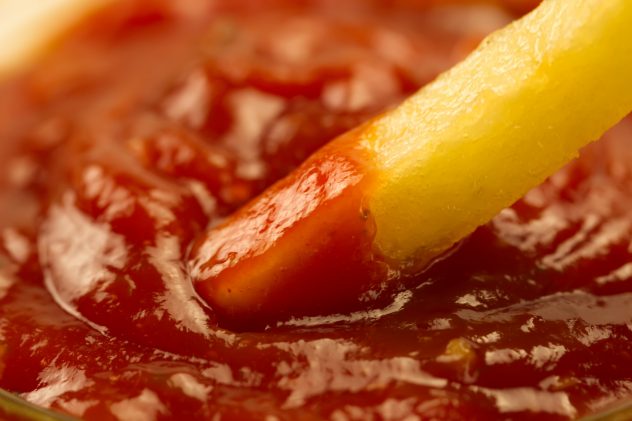 French fries and fresh ketchup, closeup