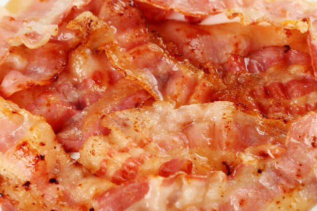 Crispy strips of bacon background, close up meat
