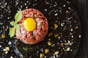 Steak tartare of raw minced meat with salt and spices