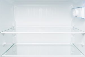 Empty shelves in refrigerator. Diet and hunger concept fridge
