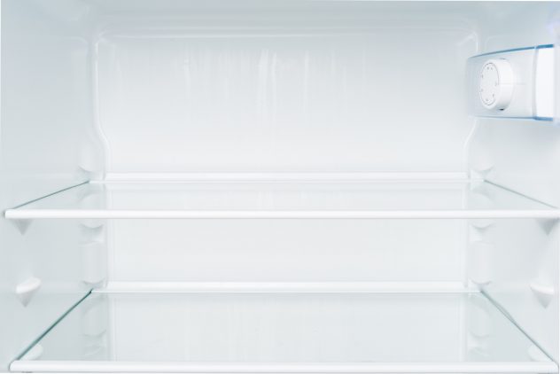Empty shelves in refrigerator. Diet and hunger concept fridge