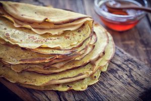 Pancake – Crepes with honey close up