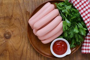 fresh homemade sausage on a wooden table