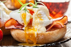 Eggs Benedict on toasted muffins with ham bread toast egg