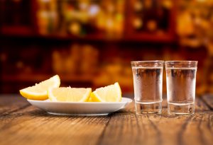 cold glasses of vodka with slices of lemon alcohol drink bar