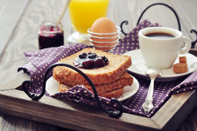 Breakfast with toast, egg coffee juice