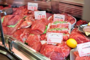 Raw meat on butcher table supermarket shop market