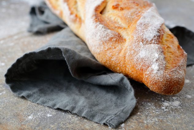 One Baguette on the slate bread