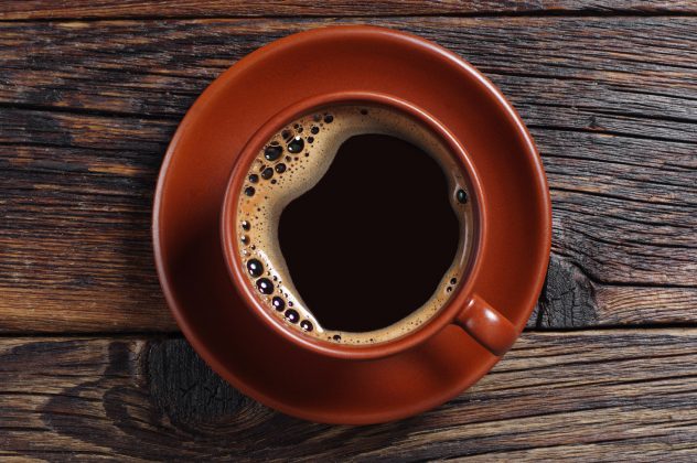 Cup of hot coffee black mug