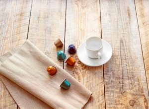 composition from capsules of coffee, cup and napkin coffee