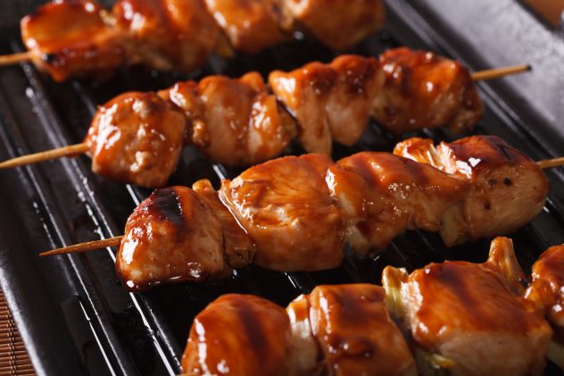 Cooking chicken yakitori of grilled. closeup horizontal skewer skewers grill grilling meat