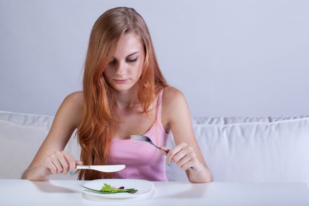 woman eat small portion lettuce diet