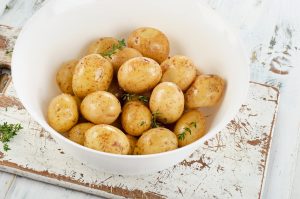 Raw potatoes with spices new bowl cooked