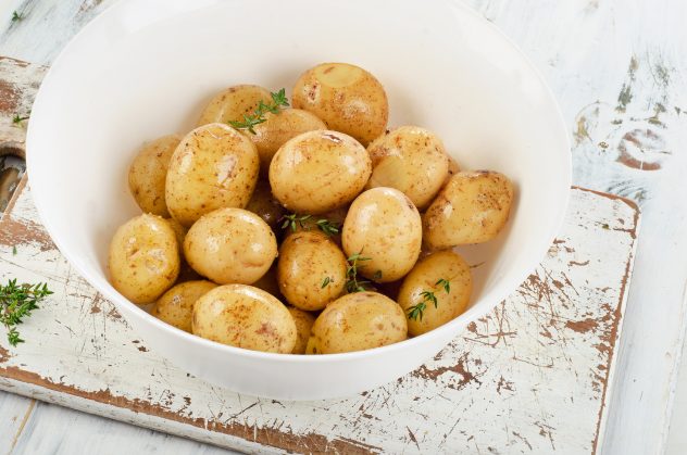 Raw potatoes with spices new bowl cooked