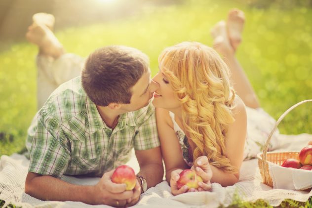 Couple on picnic apple red date