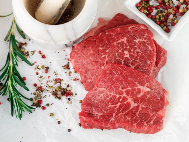 Raw fresh steaks meat beef raw from the marble beef, rosemary and spices. Top view