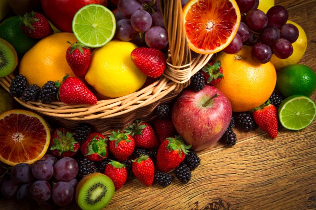 Mix of fresh fruits on wicker basket