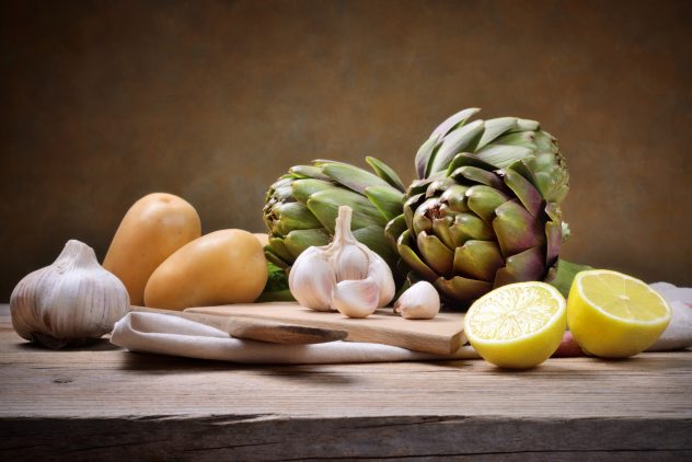 Artichokes and potatoes lemon garlic food variety display cooking making food dinner preparation home