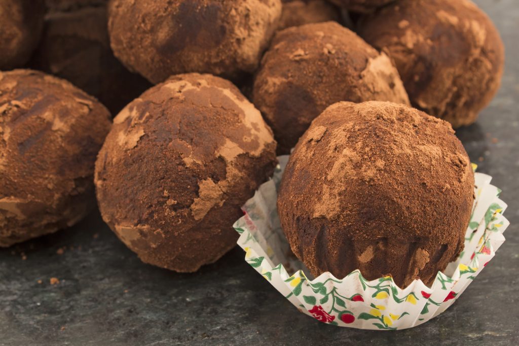 Chocolate balls truffle with rum and raisins.