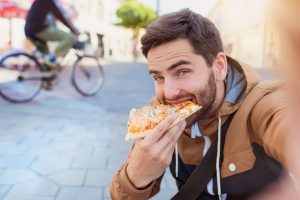 Man eating pizza