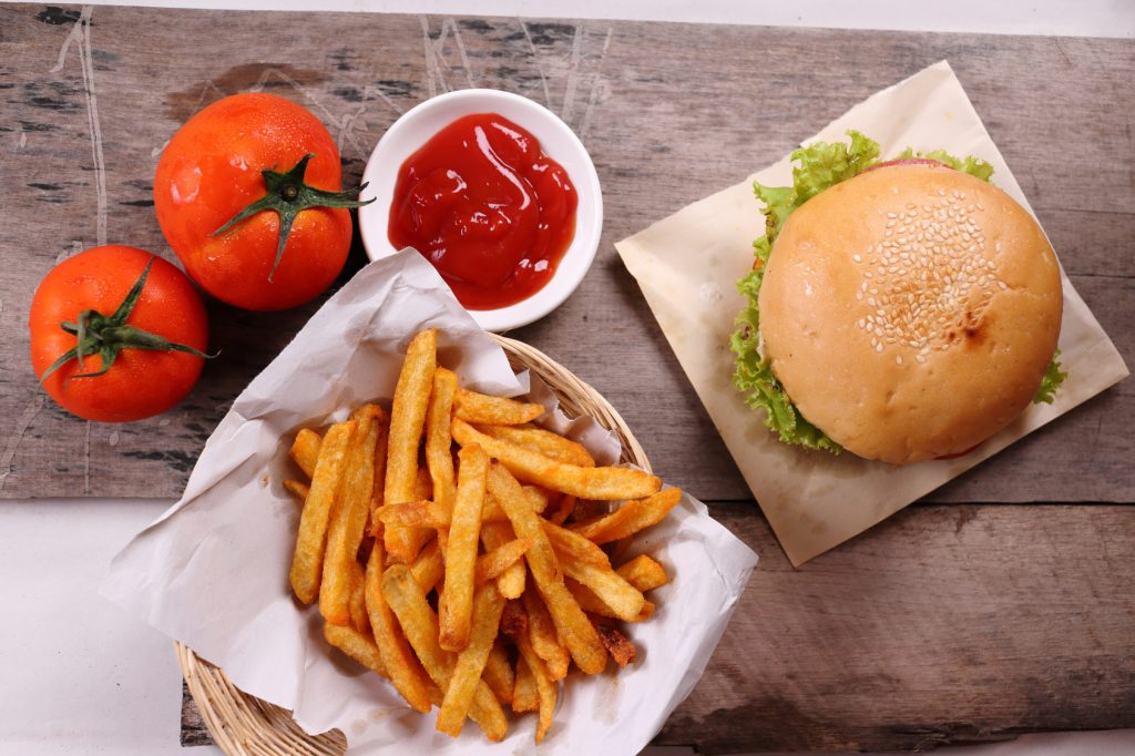 hamburger, french fries with tomatoes sauce