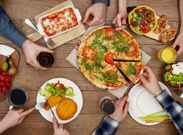 View from above the table of friends eating