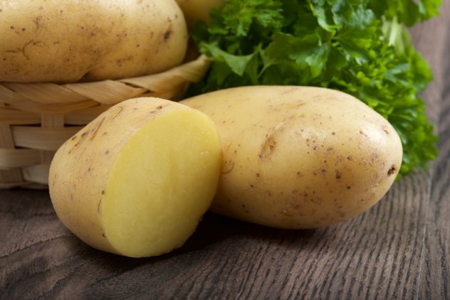 potatoes on a wooden background