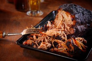 Appetizing Pulled Pork on Black Tray meat