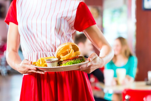 People in American diner or restaurant eating fast food