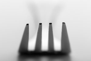 Silver fork on white background