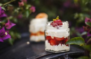 Desserts cream with strawberries and mandarins