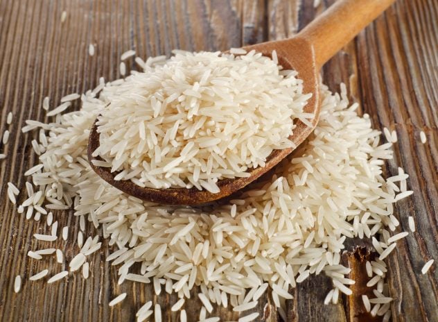 Raw basmati rice in  wooden  spoon