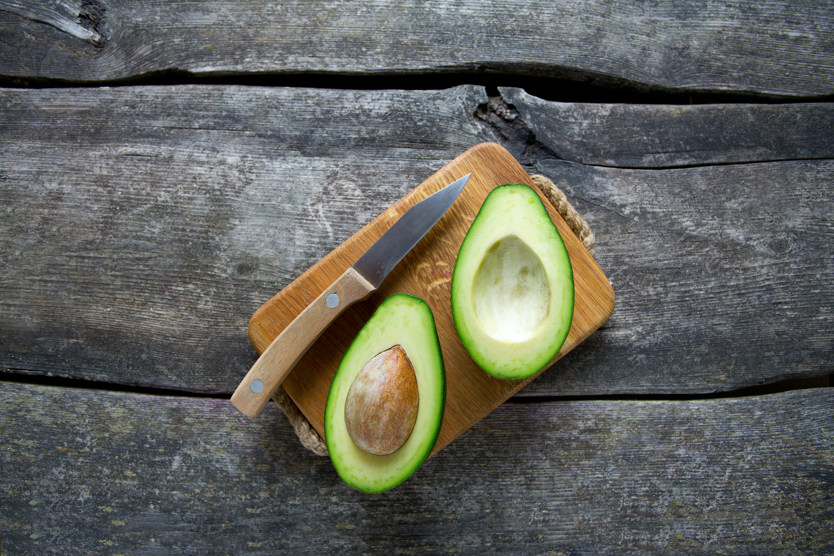 avocado on wooden surface