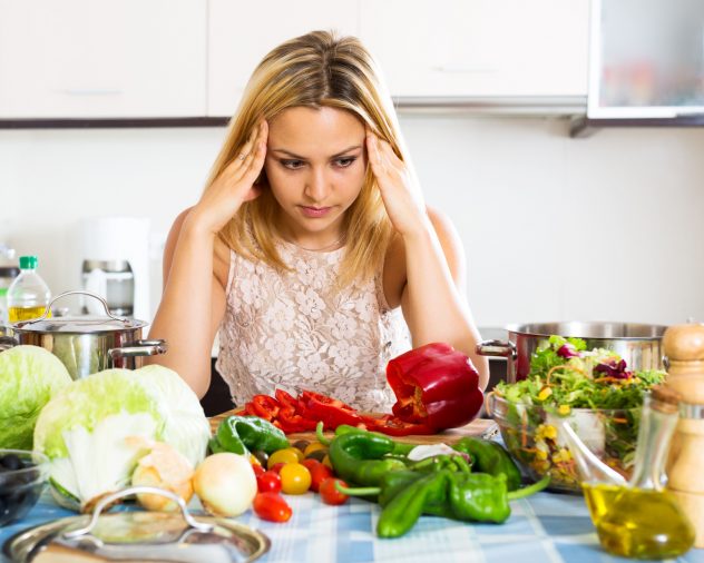 Confused housewife in the kitchen