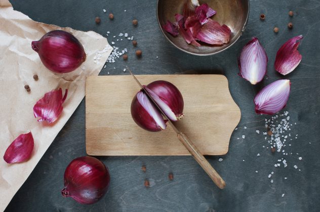 Red onion on the wooden table