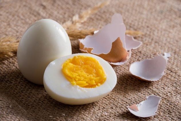 Sliced hard boiled eggs on burlap fabric