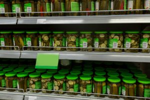 jars of pickles on grocery or supermarket shelves