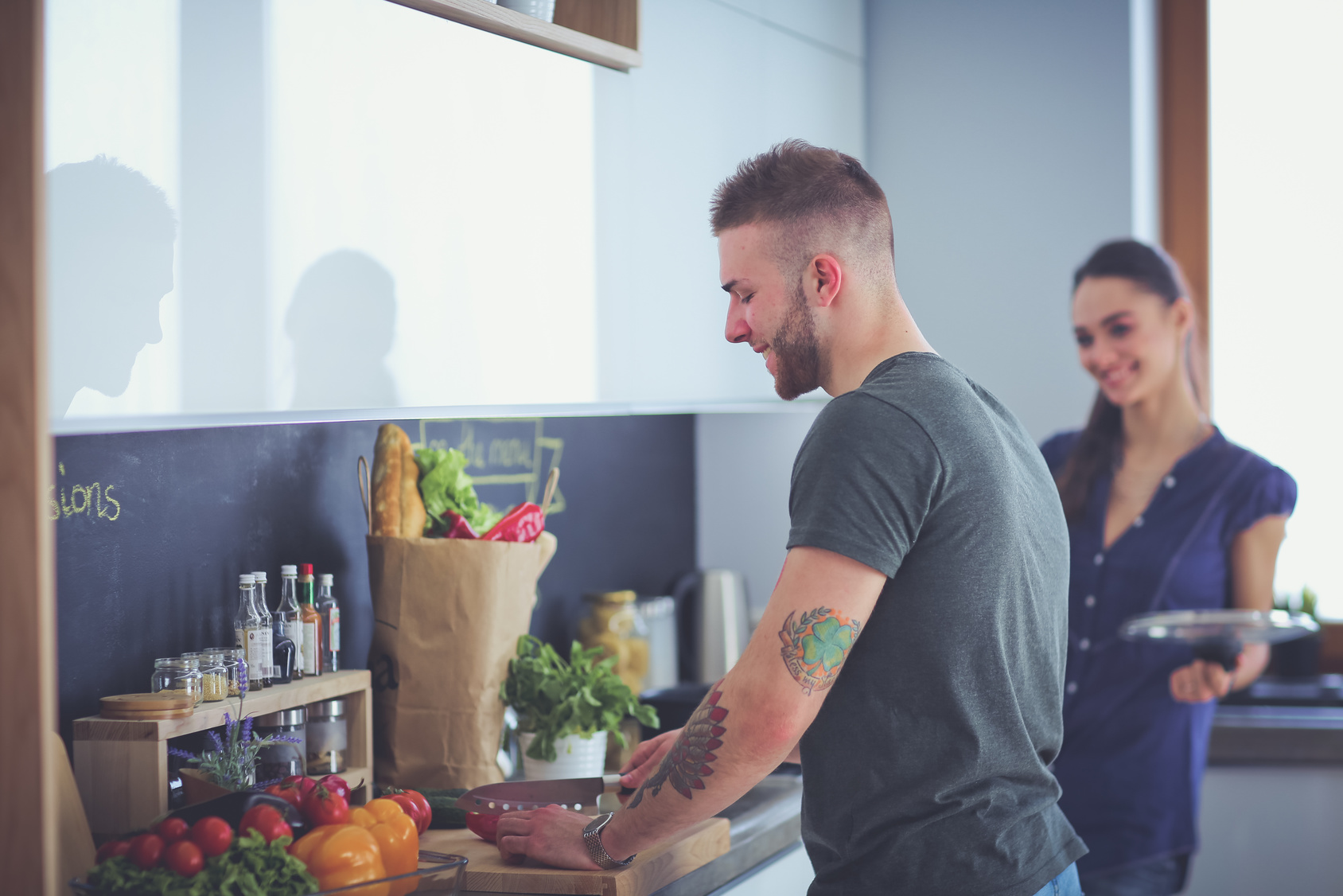 Couple cooking together in their kitchen at home