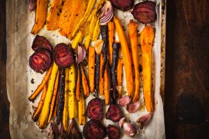 Roasted vegetables on a baking pan. Vegetarian, diet, eating food concept.