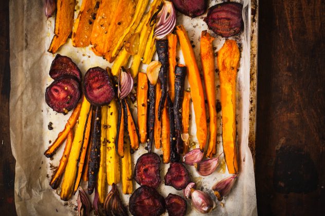 Roasted vegetables on a baking pan. Vegetarian, diet, eating food concept.